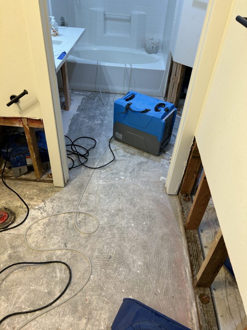 A bathroom with the floor being remodeled.